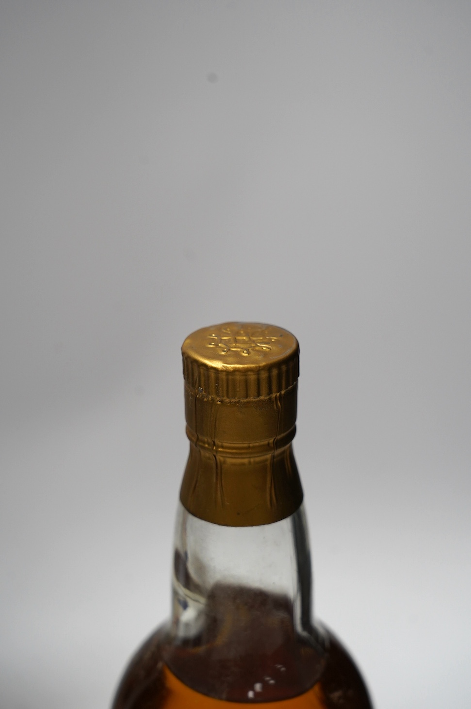 Four various bottles of alcohol to include a bottle of Taylor’s 1966 vintage port, another 1960 vintage port (label corroded), a bottle of J.de Malliac Bas Armagnac Extra Hors D’Age No.12440 and a bottle of Linie Aquavit